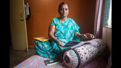 Pratibha Mahadevkar (58) survivor of Kedarnath tragedy checks photo albums at her residence at Shivne. (Pratham Gokhale/HT Photo) Pratibha Mahadevkar (58) survivor of Kedarnath tragedy checks photo albums at her residence at Shivne. (Pratham Gokhale/HT Photo)