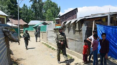 Security personnel stand guard during an encounter in Kulgam district of south Kashmir on Tuesday. Security forces gunned down two LeT militants in Shopian in the morning, including the killer of bank manager Vijay Kumar. (Waseem Andrabi/HT) Security personnel stand guard during an encounter in Kulgam district of south Kashmir on Tuesday. Security forces gunned down two LeT militants in Shopian in the morning, including the killer of bank manager Vijay Kumar. (Waseem Andrabi/HT)