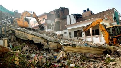 A bulldozer demolishes an illegally-constructed house of an accused in the Prayagraj violence. (ANI) A bulldozer demolishes an illegally-constructed house of an accused in the Prayagraj violence. (ANI)