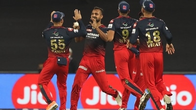Royal Challengers Bangalore players celebrate after picking a wicket (IPL/Twitter) Royal Challengers Bangalore players celebrate after picking a wicket (IPL/Twitter)