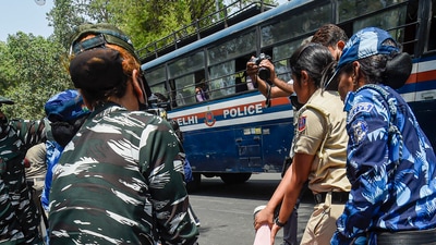 New Delhi: Police detain a woman Congress worker during a protest outside the AICC office against summoning of party leader Rahul Gandhi by the Enforcement Directorate (ED).&nbsp; (PTI)