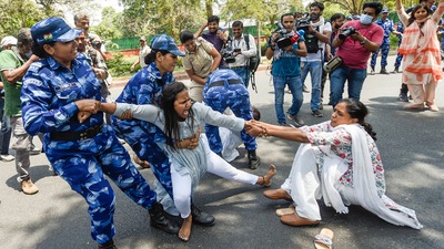 Police detain Congress workers during a protest outside the AICC office against summoning of party leader Rahul Gandhi by the Enforcement Directorate (ED) in connection with the National Herald case, in New Delhi, Wednesday, June 15, 2022. (PTI Photo/Kamal Singh) (PTI) Police detain Congress workers during a protest outside the AICC office against summoning of party leader Rahul Gandhi by the Enforcement Directorate (ED) in connection with the National Herald case, in New Delhi, Wednesday, June 15, 2022. (PTI Photo/Kamal Singh) (PTI)