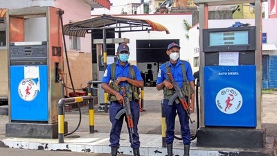 Navy officers stand guard at a closed fuel station in Colombo. (AFP) Navy officers stand guard at a closed fuel station in Colombo. (AFP)