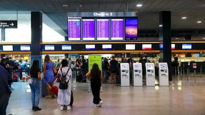 Flight departures are displayed in front of check-in counters at Zurich Airport, Switzerland July 10, 2021. REUTERS/Arnd Wiegmann (REUTERS)