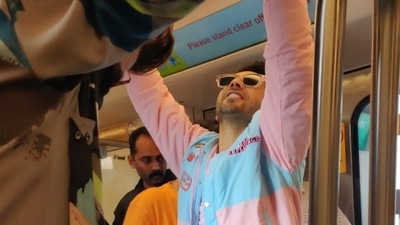 Varun Dhawan attempts a pullup inside the Mumbai Metro (Pic: Varinder Chawla). Varun Dhawan attempts a pullup inside the Mumbai Metro (Pic: Varinder Chawla).