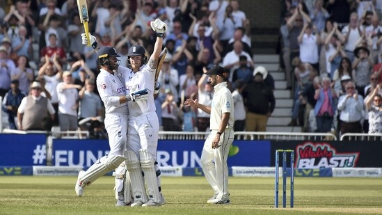 England's captain Ben Stokes, center, and batting partner Ben Foakes, left, celebrate their win on the fifth day of the second cricket test match against New Zealand at Trent Bridge in Nottingham(AP)