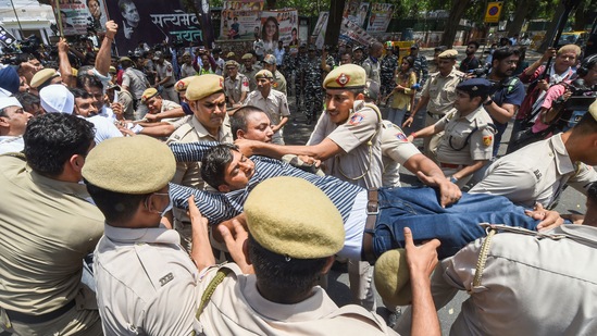 Police detain Youth Congress workers during a protest outside the AICC office against summoning of party leader Rahul Gandhi by the Enforcement Directorate (ED) in connection with the National Herald case,(PTI)