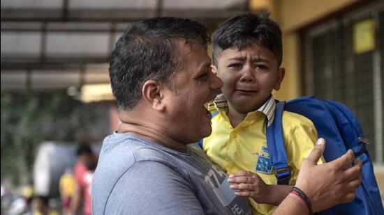A little child cries as he attends school on the first day of reopening after summer vacations at Orion School, Vile Parle on Wednesday. (Satish Bate/HT PHOTO)