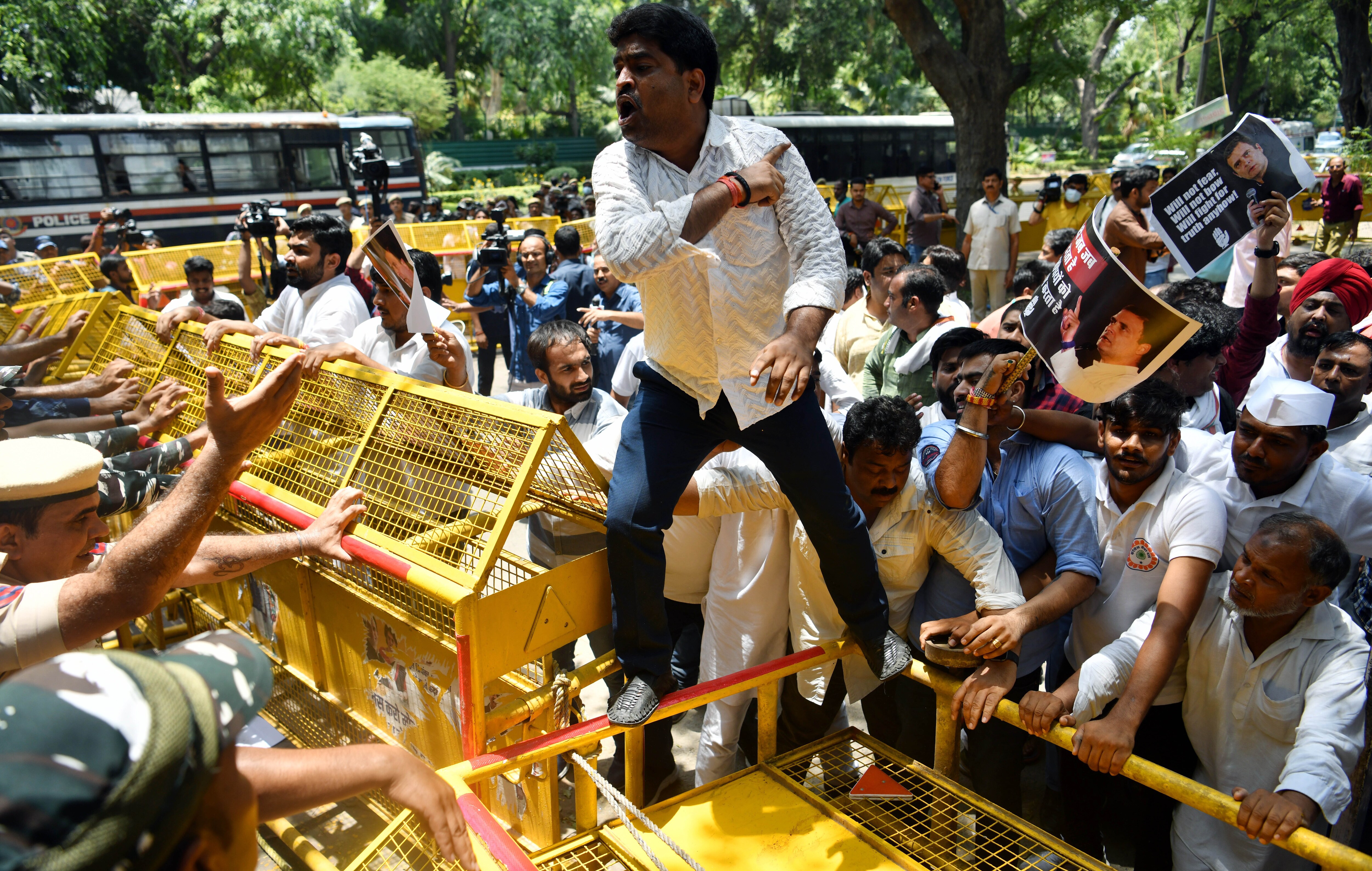 Police personnel stop Congress leaders and supporters from marching towards Enforcement Directorate (ED) office during a protest over the ED's probe against party leader Rahul Gandhi as he appears before the agency on the third consecutive day in connection with the National Herald case, outside AICC headquarters, in New Delhi on Wednesday, June 15, 2022. (ANI Photo/Rahul Singh)
