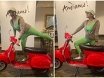 Huma Qureshi has won hearts of many with not just her incredible performances in films but also her cheerful and bubbly personality. The actor recently showed her goofy side as she struck some funny poses on a vintage red scooter donning a green active wear set.(Instagram/@iamhumaq)