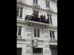 The image, taken from the viral Instagram video that former president Barack Obama posted, shows the singers in a balcony.