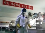 A health official of the Pyongyang Sports Goods Factory disinfects the floor of a work place in Pyongyang, North Korea, Tuesday, June 14, 2022. (AP Photo/Cha Song Ho) A health official of the Pyongyang Sports Goods Factory disinfects the floor of a work place in Pyongyang, North Korea, Tuesday, June 14, 2022. (AP Photo/Cha Song Ho)