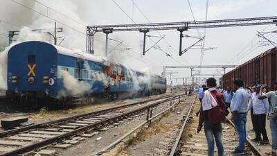 A rain set on fire at Chapra railway station on Thursday. (Santosh Kumar/HT Photo)
