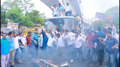 Congress workers pelted stones at the Telangana State Road Transport Corporation buses and set fire to a two-wheeler in Hyderabad on Thursday. (HT Photo)