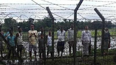 Indian villagers outside the fence along the India-Bangladesh international border near Assam’s Karimganj wait for the Border Security Force to open the gates. (HT Photo) Indian villagers outside the fence along the India-Bangladesh international border near Assam’s Karimganj wait for the Border Security Force to open the gates. (HT Photo)