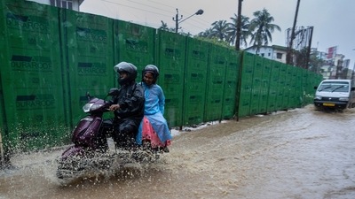A couple ride on a scooter through a flooded road after heavy rains in Gauhati, (File image) (AP) A couple ride on a scooter through a flooded road after heavy rains in Gauhati, (File image) (AP)