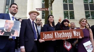 Participants stand for a group photo after unveiling a new street sign for Jamal Khashoggi Way outside of the Embassy of Saudi Arabia. (AP) Participants stand for a group photo after unveiling a new street sign for Jamal Khashoggi Way outside of the Embassy of Saudi Arabia. (AP)