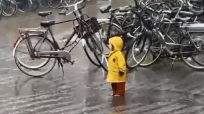 The image, taken from the viral Twitter video, shows the kid in the rain. (Screengrab)