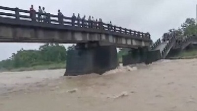 Assam: Portion of bridge collapses in Baksa district amid torrential rains (ANI)