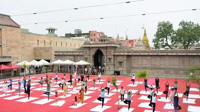 Students do yoga at Kashi Vishwanath temple complex in Varanasi ahead of the International Yoga Day. (ANI PHOTO) Students do yoga at Kashi Vishwanath temple complex in Varanasi ahead of the International Yoga Day. (ANI PHOTO)