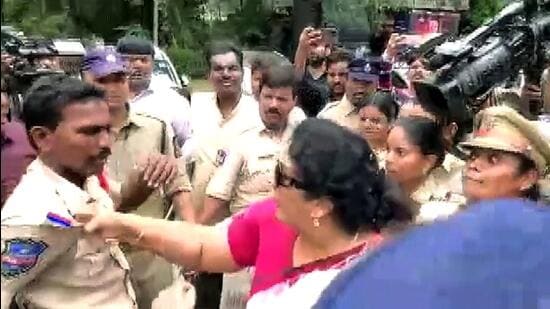 Congress leader Renuka Chowdhury holds a policeman by his collar while being taken away by other police personnel during a protest over the summoning of party leader Rahul Gandhi by the Enforcement Directorate in connection with the National Herald case, in Hyderabad on Thursday. (ANI)