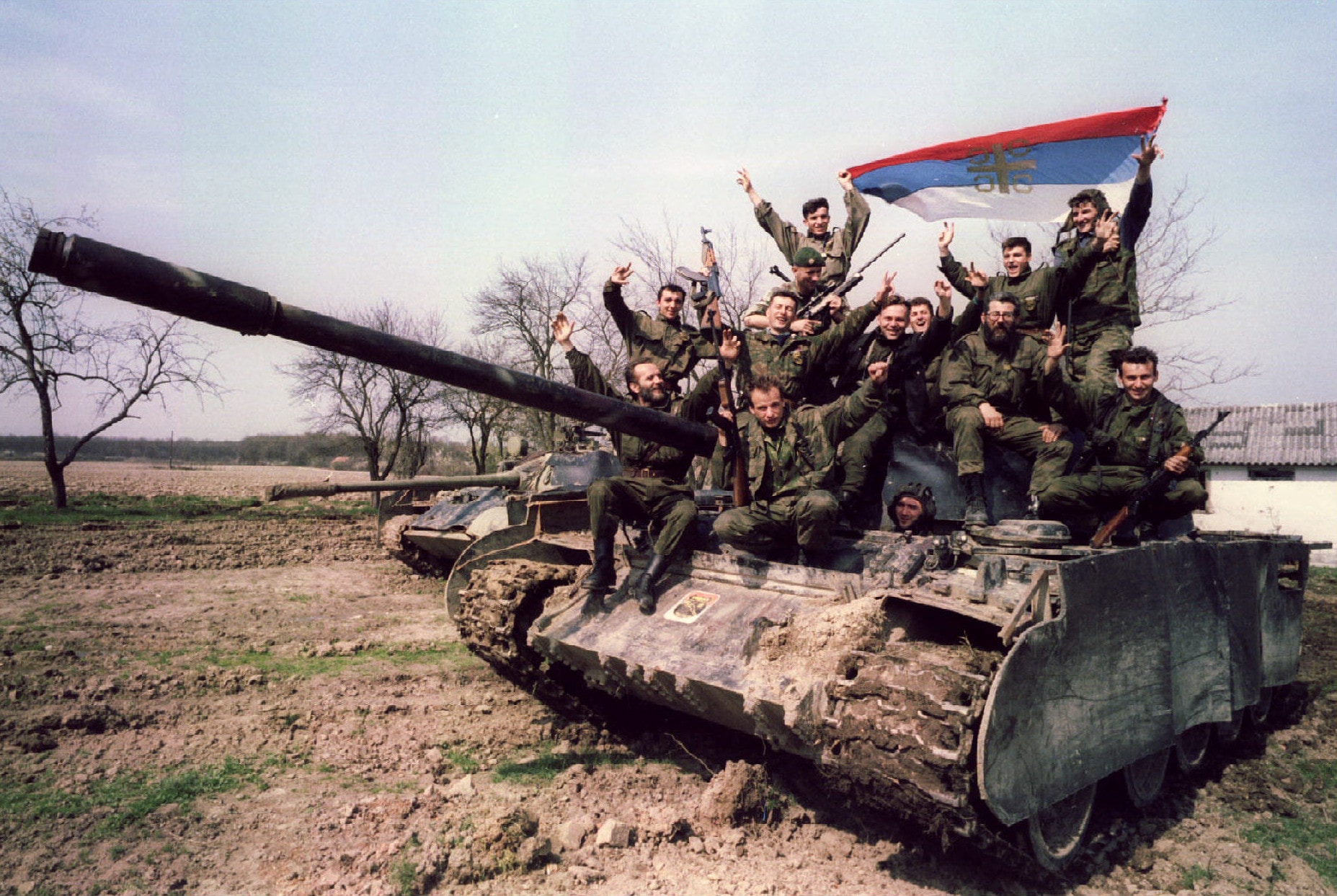 Bosnian Serb soldiers pose with the Serbian flag on 29 March 1994 near the northern Bosnian town of Brcko. (Reuters) Bosnian Serb soldiers pose with the Serbian flag on 29 March 1994 near the northern Bosnian town of Brcko. (Reuters)