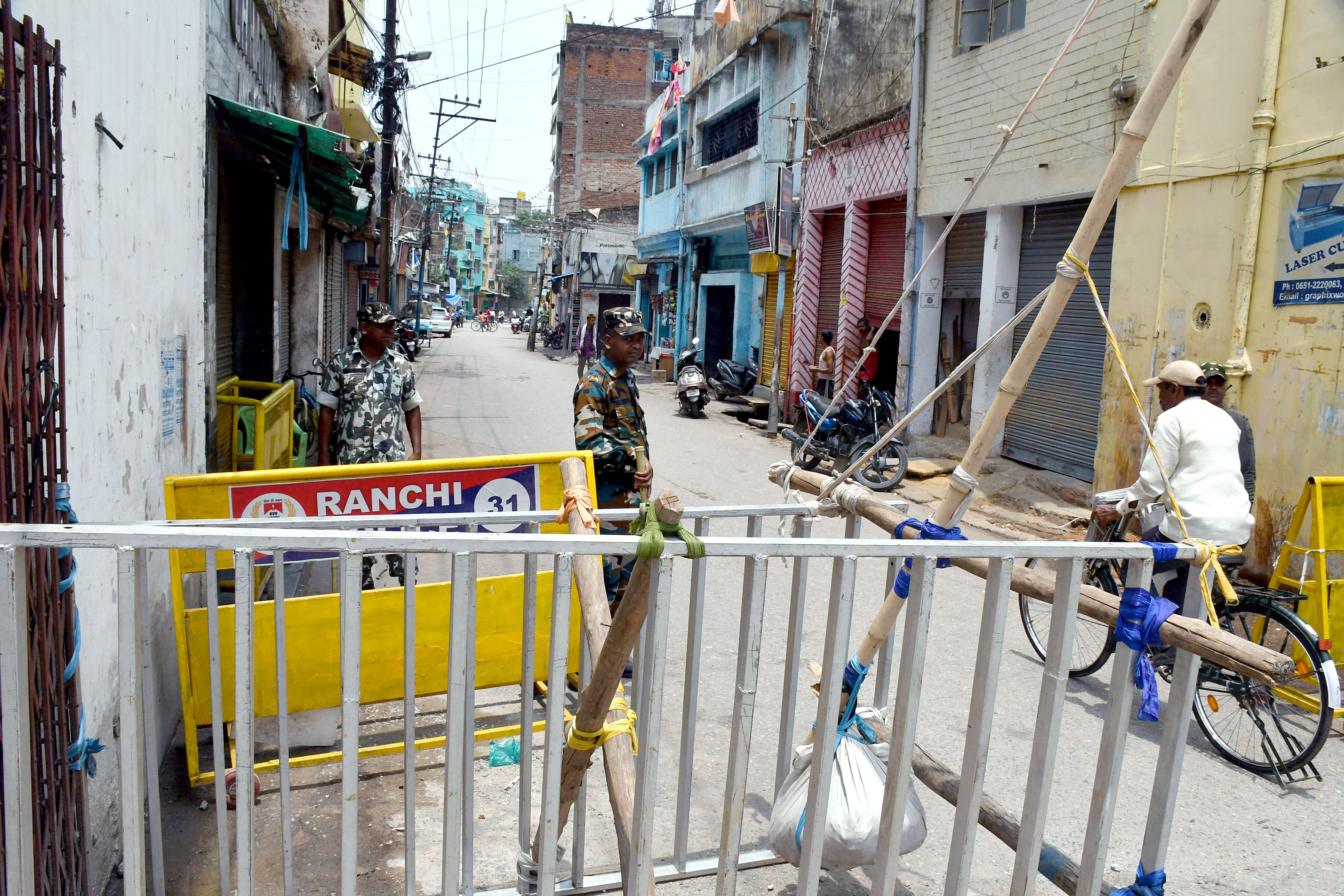 Paramilitary personnel stand guard at the barricaded area where a violent protest broke out on June 10th against suspended BJP leader Nupur Sharma over her alleged remarks on Prophet Muhammad, in Ranchi on Thursday, June 16, 2022. (ANI Photo) (Somnath Sen)