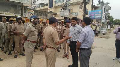 The DM and SSPissuing instructions during their round of the old city area in Prayagraj on Friday. (HT) The DM and SSPissuing instructions during their round of the old city area in Prayagraj on Friday. (HT)