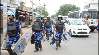 Security personnel on guard in old city areas of Atala and localities nearby on Thursday. (Anil Kumar Maurya/ht photo)