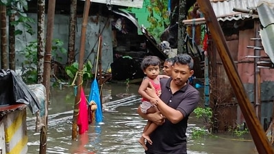 SDRF members carry out rescue work in a flood-hit locality in Bongaigaon town of Assam. (PTI)