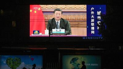 This file photo taken on September 10, 2021 shows a large screen displaying a news programme featuring Chinese President Xi Jinping speaking via video at the opening of the virtual BRICS Summit being hosted by India, on a street in Beijing. (AFP) This file photo taken on September 10, 2021 shows a large screen displaying a news programme featuring Chinese President Xi Jinping speaking via video at the opening of the virtual BRICS Summit being hosted by India, on a street in Beijing. (AFP)