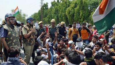 Police personnel interact with the protestors during a demonstration against the Agnipath recruitment scheme for the armed forces, at the Agra-Delhi national highway, in Mathura on Friday. (ANI PHOTO) Police personnel interact with the protestors during a demonstration against the Agnipath recruitment scheme for the armed forces, at the Agra-Delhi national highway, in Mathura on Friday. (ANI PHOTO)