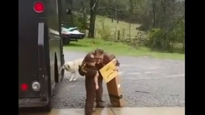 The image, taken from the viral Reddit video, shows the kid with the delivery driver. (Reddit/@thegrandconduit)