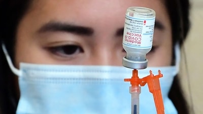 The Moderna Covid-19 vaccine is prepared for administration at Union Station in Los Angeles. (AFP) The Moderna Covid-19 vaccine is prepared for administration at Union Station in Los Angeles. (AFP)