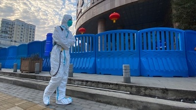  A worker in protectively overalls and carrying disinfecting equipment walks outside the Wuhan Central Hospital, China. (AP / File) A worker in protectively overalls and carrying disinfecting equipment walks outside the Wuhan Central Hospital, China. (AP / File)