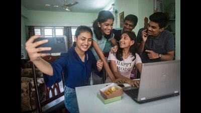 Students of Class 10 react as they check their results on a laptop at SB road on Friday. (Pratham Gokhale/HT Photo)