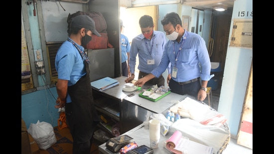 Packed food weight being checked at the pantry car of Jhelum Express on Friday. (Shankar Narayan/HT PHOTO)