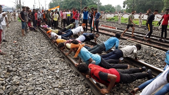 Army aspirants perform pushups on a railway track, blocking it to protest against the Agnipath Recruitment Scheme for the Armed Forces, in Dhanbad, Jharkhand, on Friday, June 17, 2022. (ANI Photo)(Chandan Paul)