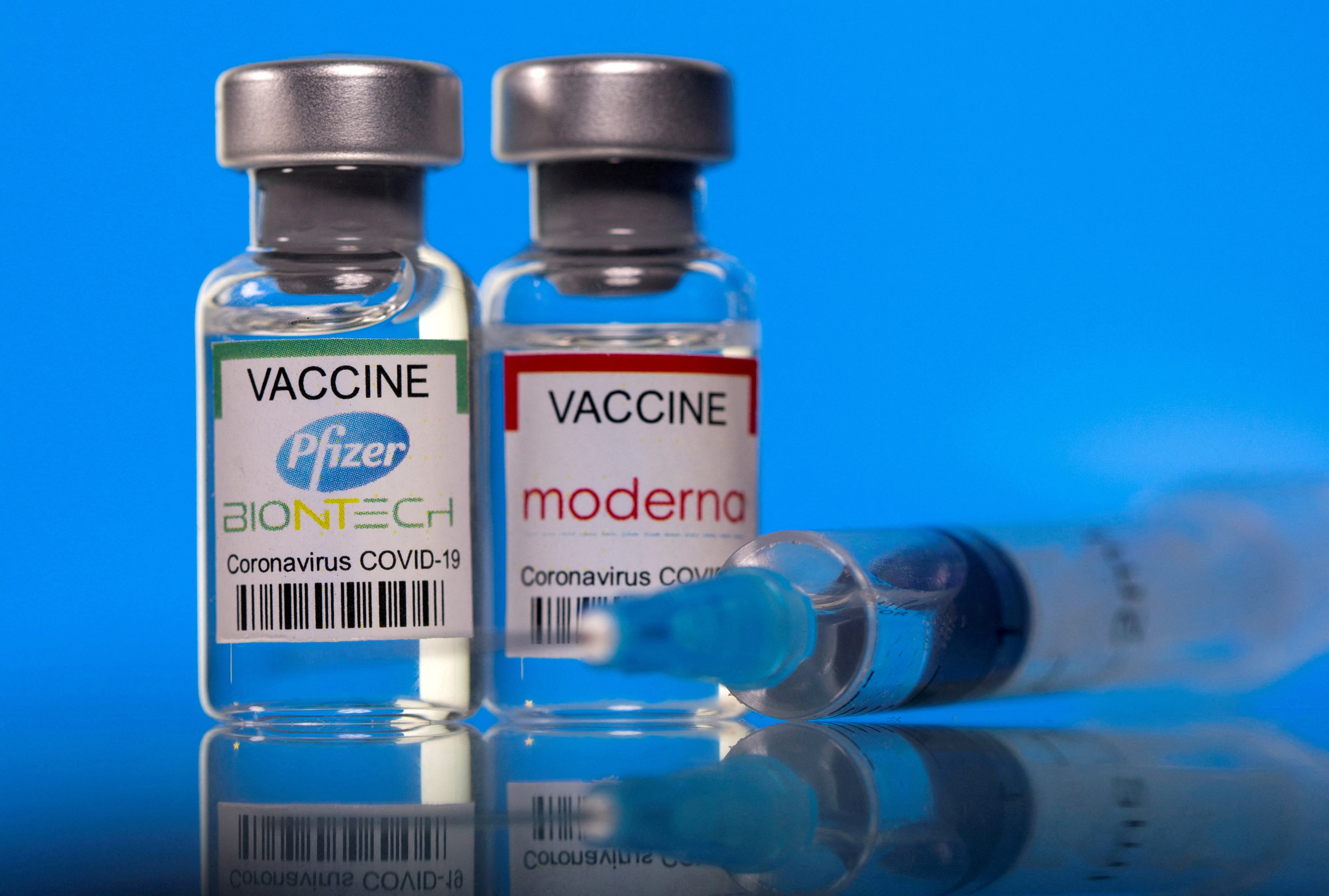 FILE PHOTO: Vials with Pfizer-BioNTech and Moderna coronavirus disease (COVID-19) vaccine labels are seen in this illustration picture. (REUTERS)
