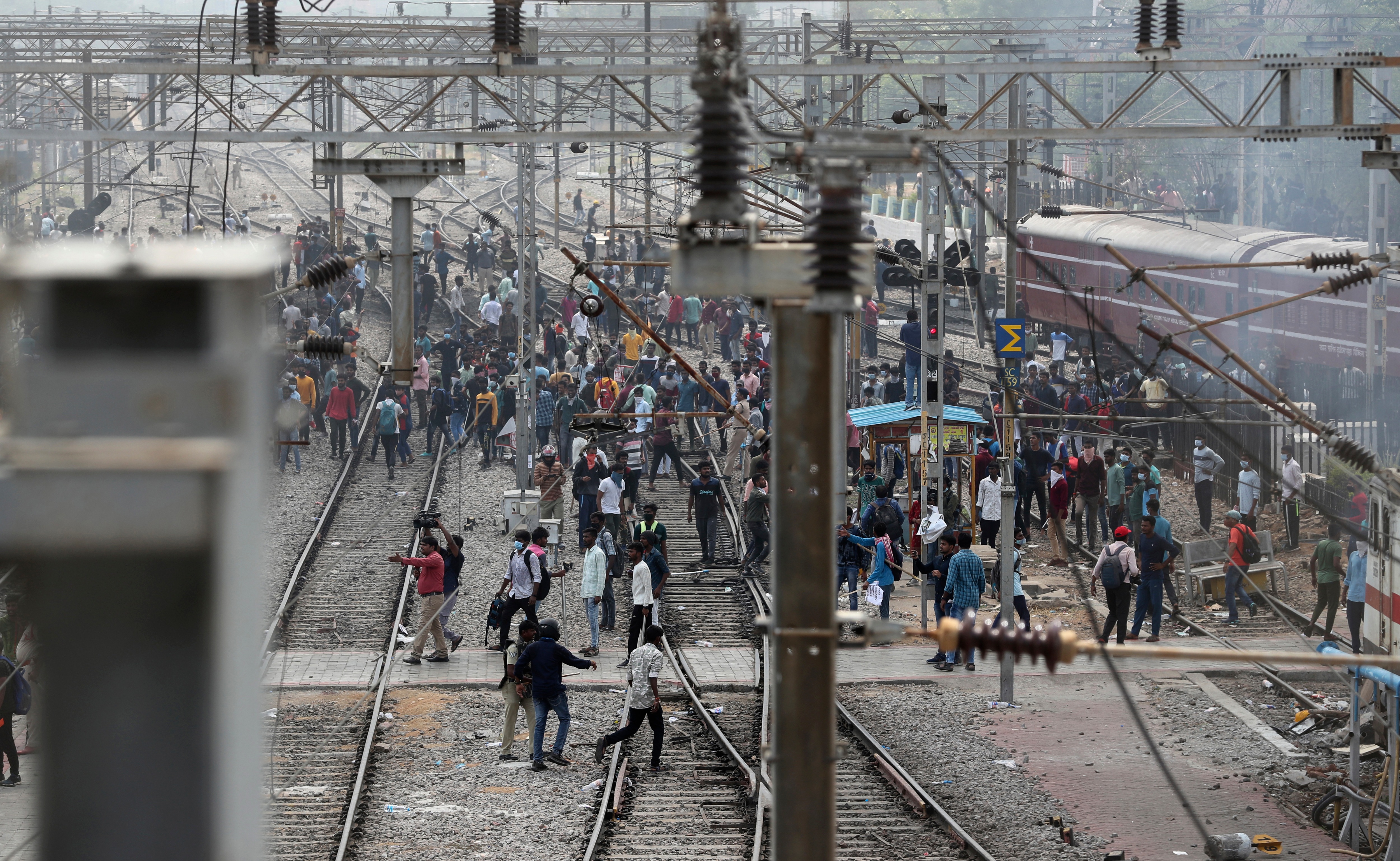 Protestors throw stones at Secunderabad railroad station in Hyderabad, on &nbsp;June 17, 2022.&nbsp; (AP)