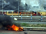 A train set on fire by a crowd against the Centre’s Agnipath at Danapur railway station. (PTI) A train set on fire by a crowd against the Centre’s Agnipath at Danapur railway station. (PTI)