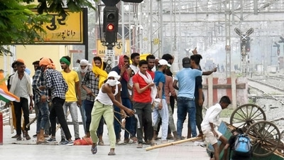 People vandalise railway property at Danapur Railway Station during a protest against the Agnipath army recruitment scheme. (Santosh Kumar /Hindustan Times)
