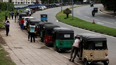 Three-wheeler drivers wait in a queue to buy petrol due to fuel shortage, amid the country's economic crisis, in Colombo, Sri Lanka. (REUTERS)