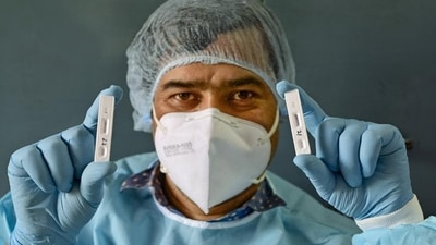A healthworker shows samples after conducting COVID-19 tests, in New Delhi.&nbsp;