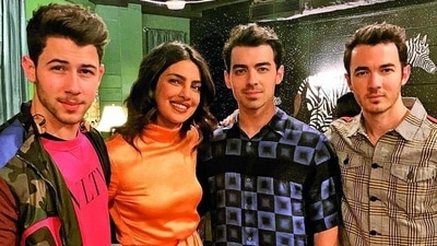 Priyanka Chopra with Jonas Brothers at a concert.&nbsp;