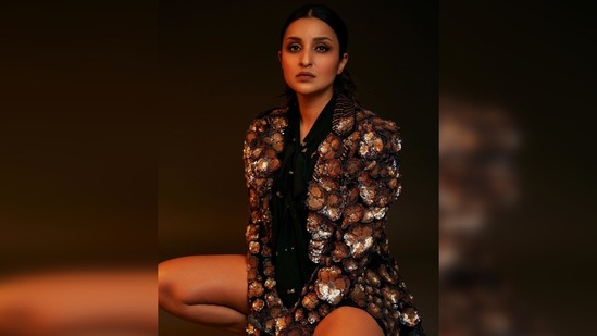 Parineeti Chopra's hair was flattened and parted in the middle and tied into a loose low messy bun.(Instagram/@parineetichopra)