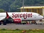 The Delhi-bound SpiceJet airplane following its emergency landing after it catches fire mid-air at Jayprakash Narayan Airport in Patna on Sunday. (HT photo)