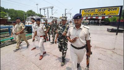 Security personnel outside Patna railway station after several trains were cancelled due to protests against the Centre's 'Agnipath' scheme, in Patna on Sunday. (PTI PHOTO.) Security personnel outside Patna railway station after several trains were cancelled due to protests against the Centre's 'Agnipath' scheme, in Patna on Sunday. (PTI PHOTO.)