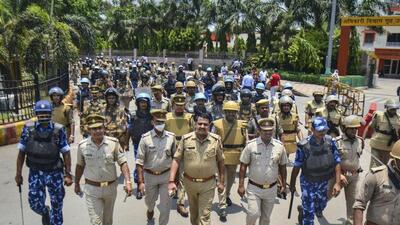 Security personnel patrolling the area near the Varanasi railway station. (PTI PHOTO)