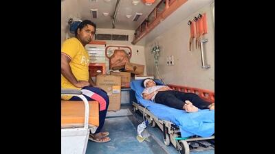 Woman, who was lying unconscious under the bridge , being taken to a hospital in an ambulance in Ludhiana. (HT PHOTO)